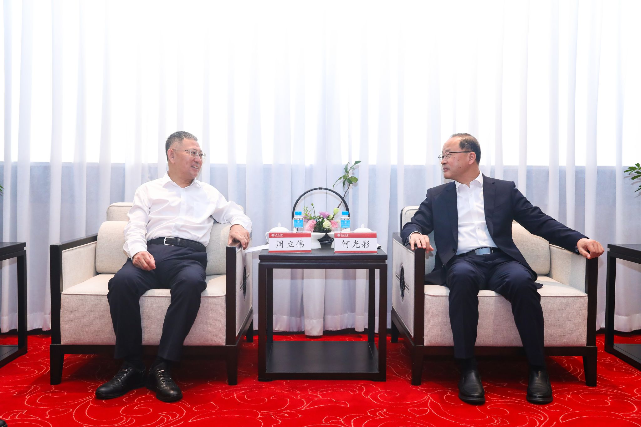 何光彩会见周立伟1.jpg